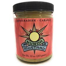 Jar of mustard with a red label featuring a sun design and text.
