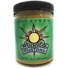 Jar of Nunda Mustard with a green label featuring a sun design.
