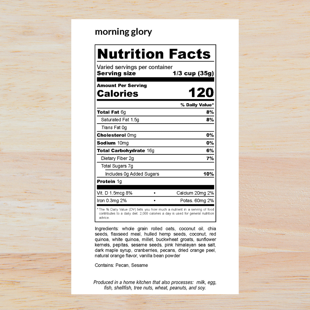 A Nutrition Facts label from the brand 'morning glory' shown on a light wood background. The label is white with black text and outlines the nutritional facts for a protein powder serving size of 1/3 cup (35g), with ingredients listed below.