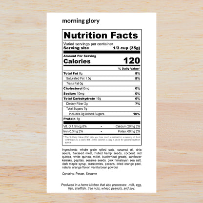A Nutrition Facts label from the brand 'morning glory' shown on a light wood background. The label is white with black text and outlines the nutritional facts for a protein powder serving size of 1/3 cup (35g), with ingredients listed below.