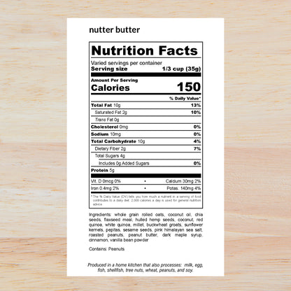 A Nutrition Facts label for nutter butter shown on a light wood background. The label is black and white, detailing calories, fat, protein, and ingredients for a serving size of 1/3 cup (35g).