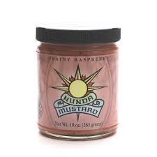 Jar of Dundo Mustard with a black lid on a white background