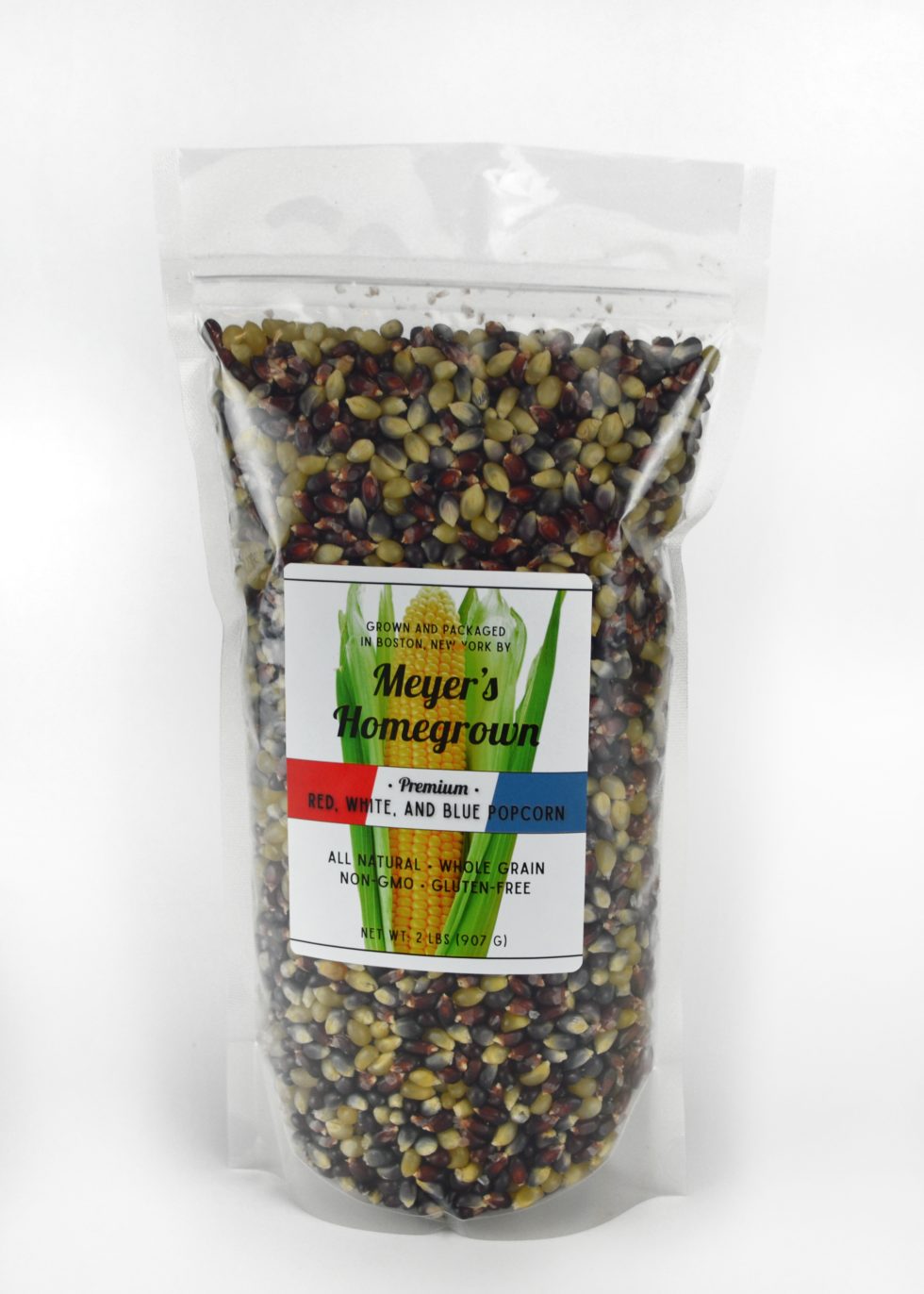Bag of mixed seeds with a label on a white background